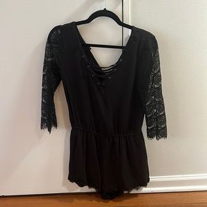 Black romper from Jack - 3/4 length sleeves & shorts. Size S but fits like an XS